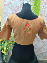 Light orange blouse with red flower embroidery front and back