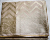 Beige Semi Banaras saree with silver design border