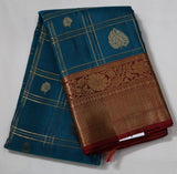 Peacock blue Kanjivaram Saree with Maroon Silver Zari Border