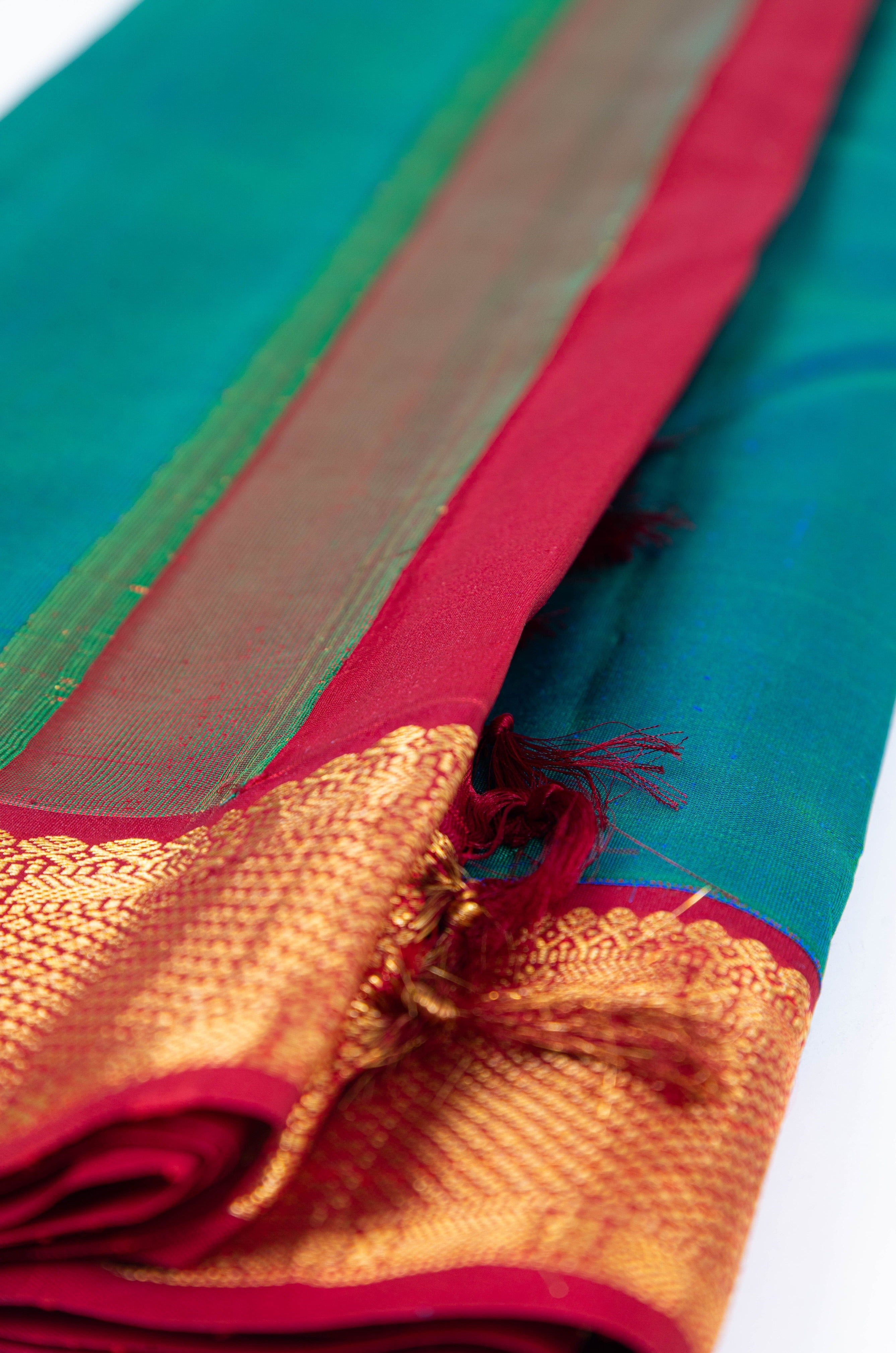 Peacock Blue Plain Kanjivaram Saree with Red Border