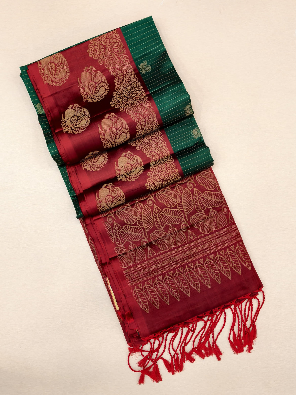 Green Soft Silk Saree with maroon border and pallu with zari peacock motifs