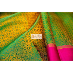 Emerald green with pink plain border kanjivaram sari
