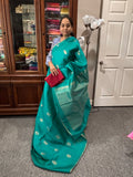 Teal color raw silk saree