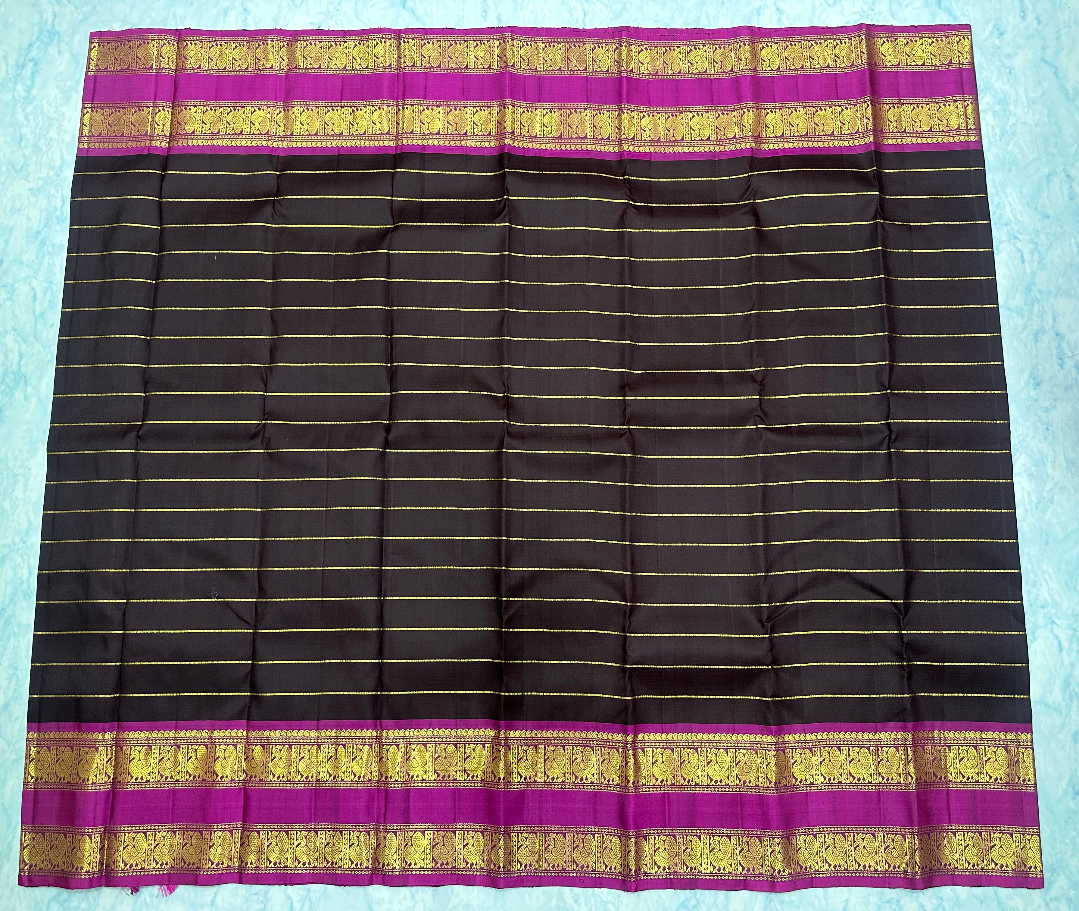 Dark Maroon Kanjivaram Saree with  Rani Pink and gold Zari Border