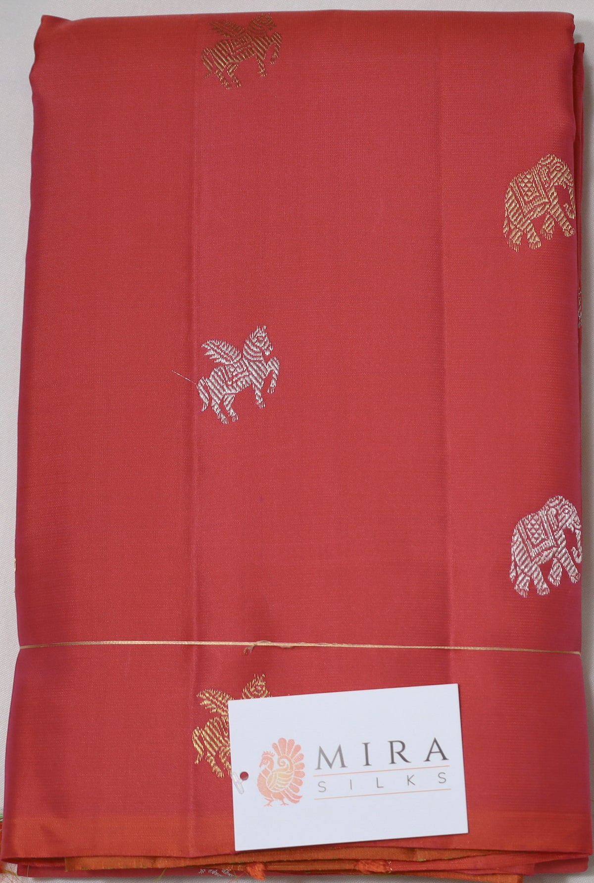 Peach borderless Kanjivaram Saree with unique motifs