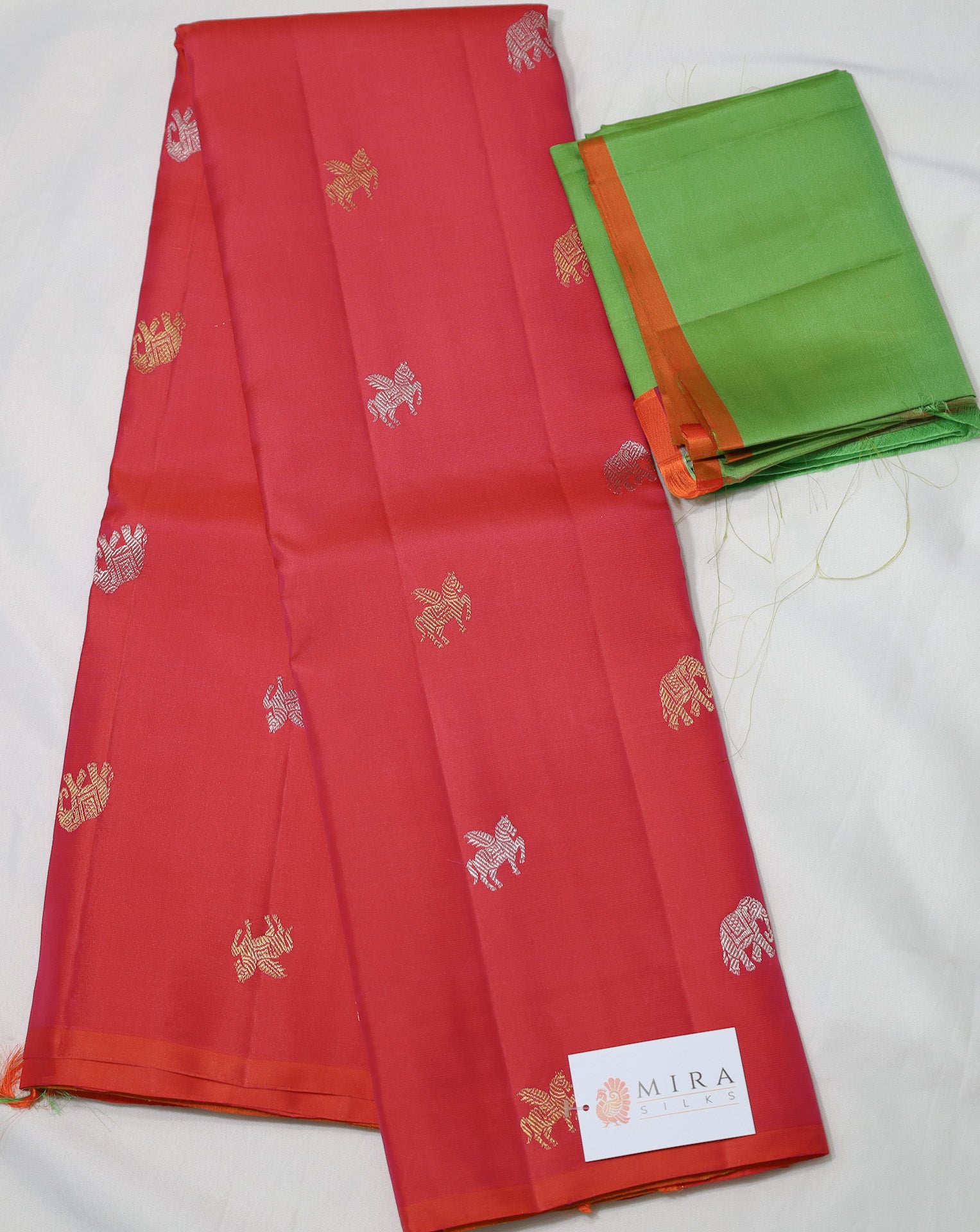 Peach borderless Kanjivaram Saree with unique motifs
