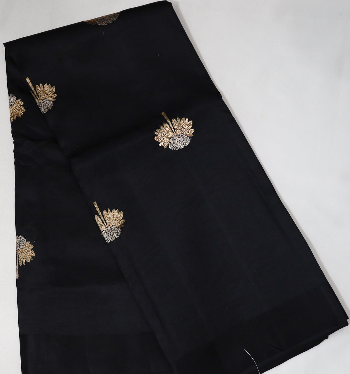 Black Raw Mango Saree with Golden Silver Flower Buttas