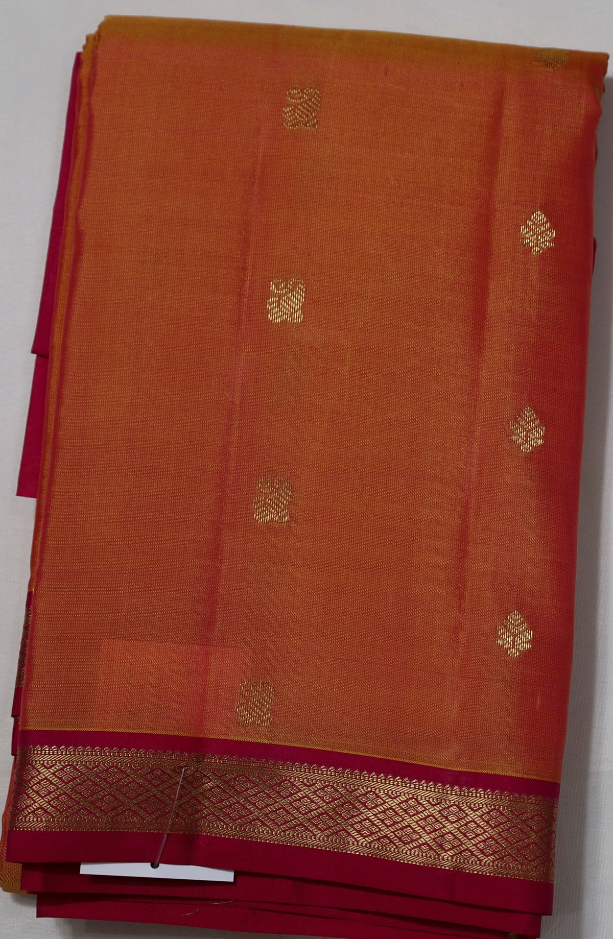 Orange Kanjivaram Saree with  Pink and Golden Zari Border