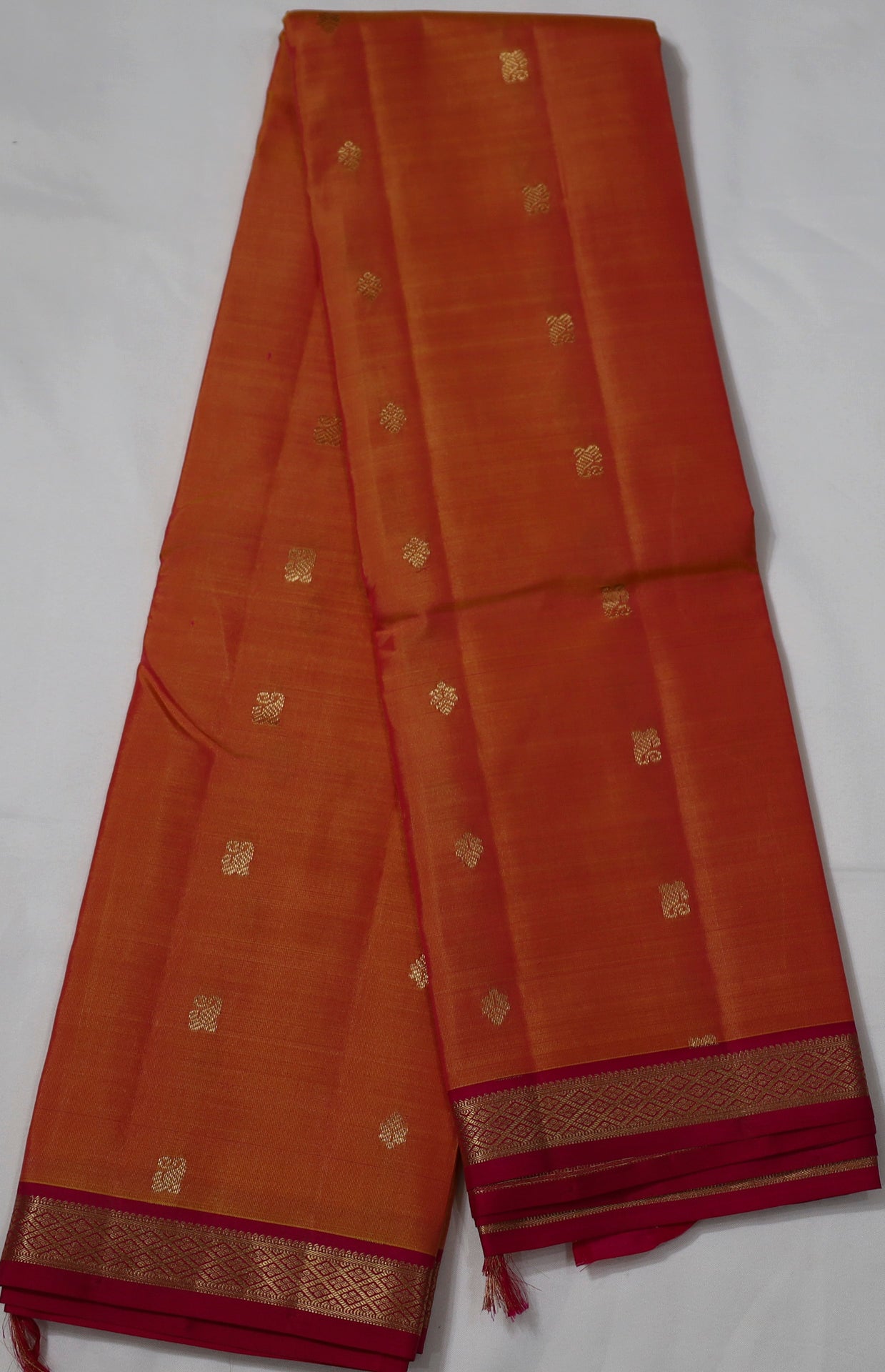 Orange Kanjivaram Saree with  Pink and Golden Zari Border