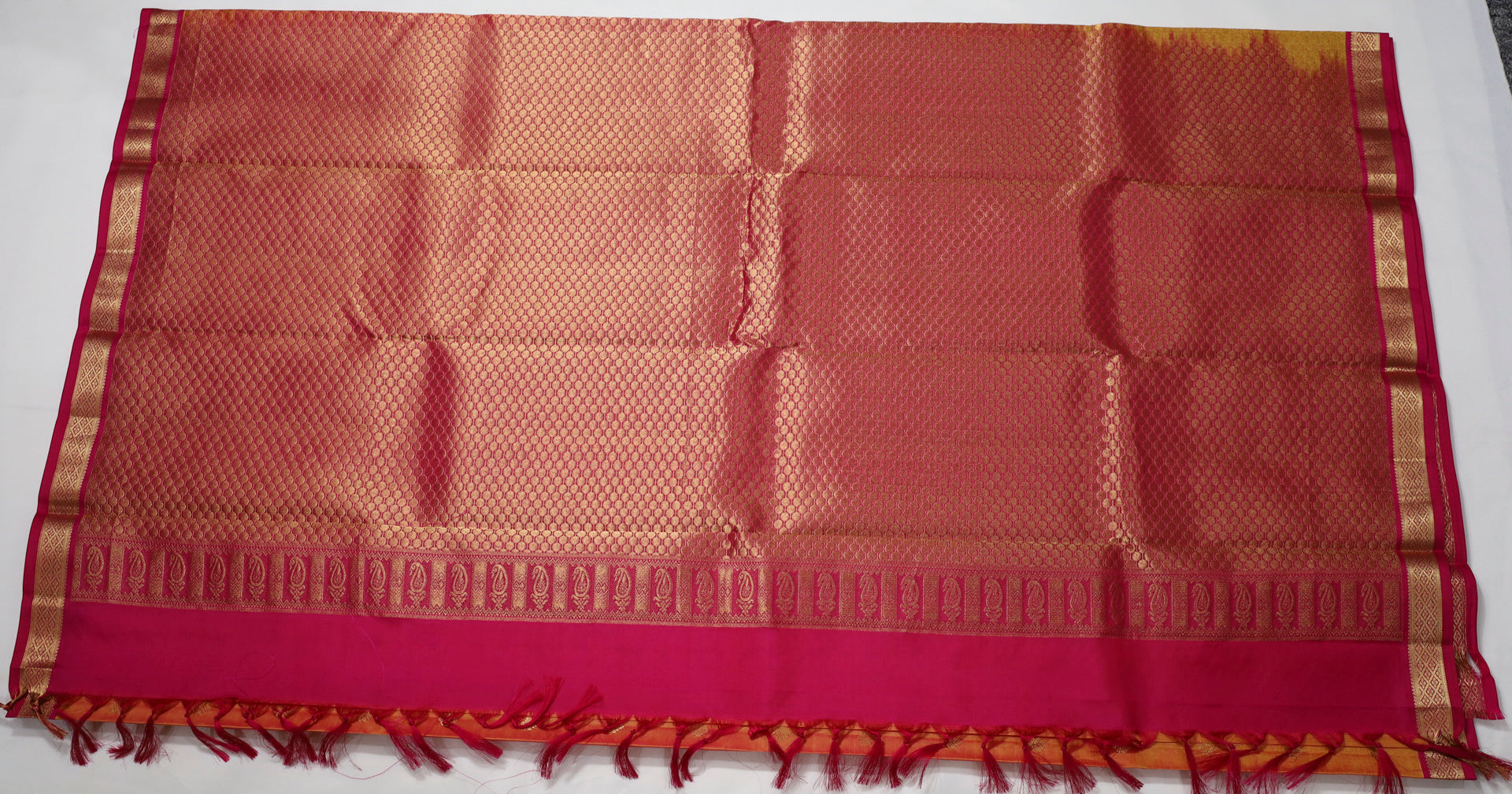 Orange Kanjivaram Saree with  Pink and Golden Zari Border
