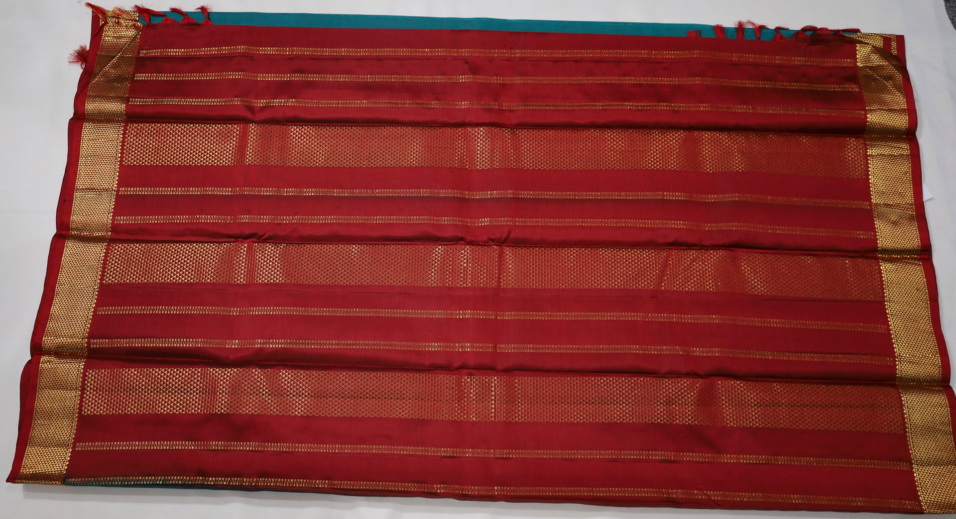 Peacock Green Kanjivaram Saree with Red and golden Zari Border