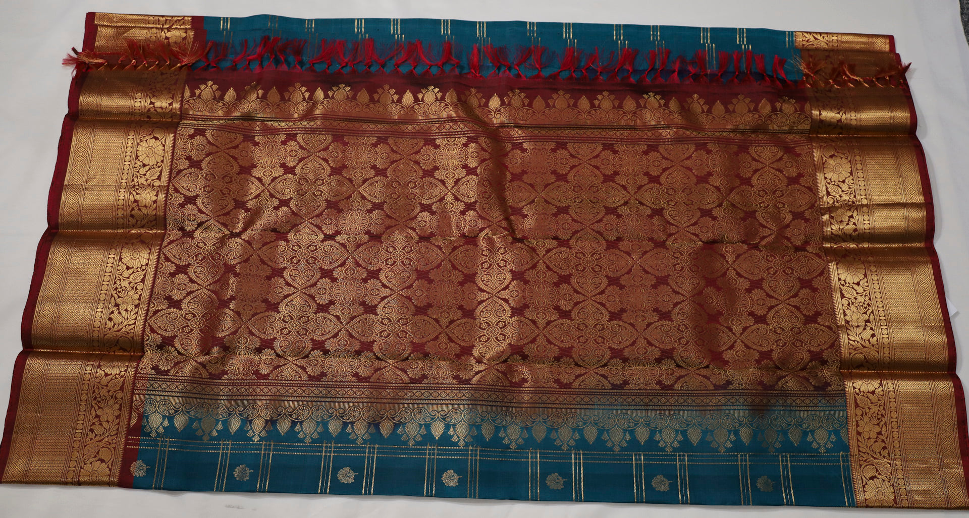 Peacock blue Kanjivaram Saree with Maroon Silver Zari Border