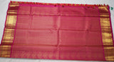 Orange Kanjivaram Saree with  Pink and golden Zari Border
