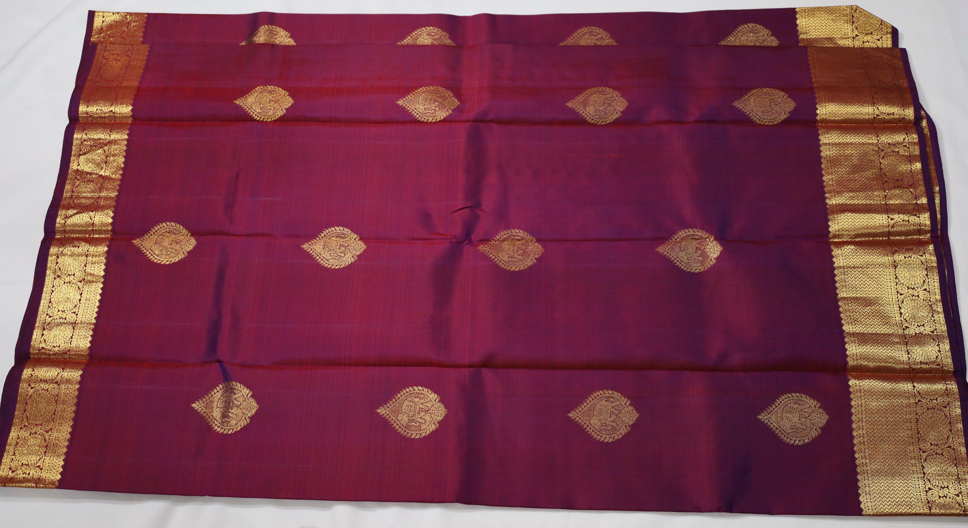 Wine Kanjivaram Saree with  golden Zari Border