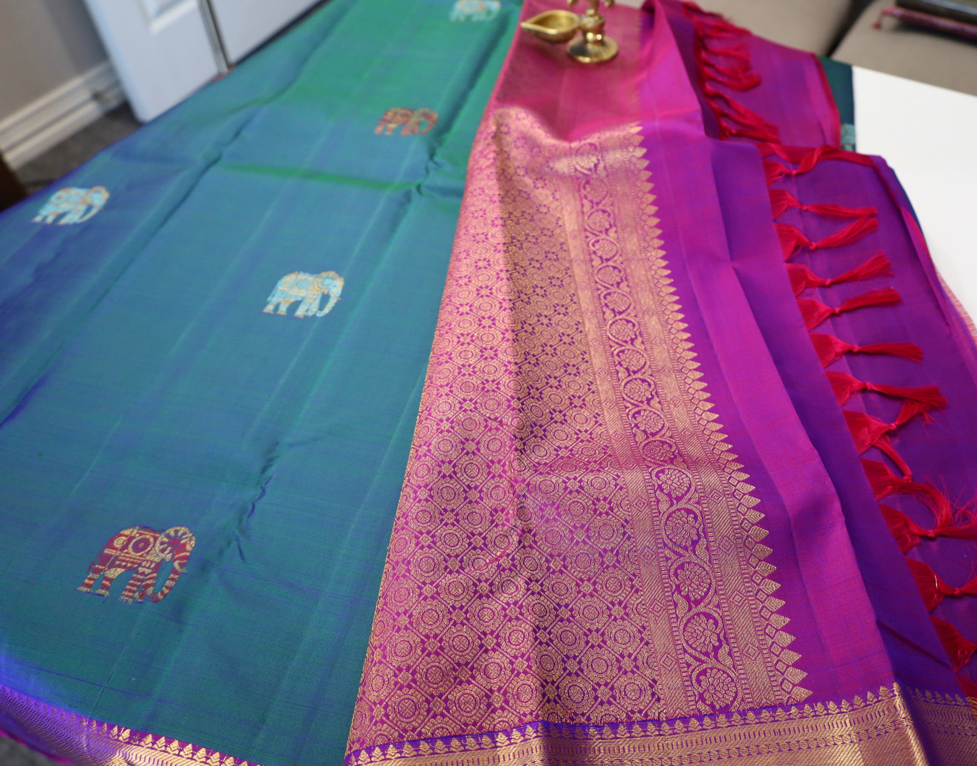 Peacock Blue Kanjivaram Saree with Purple and Golden Zari Border