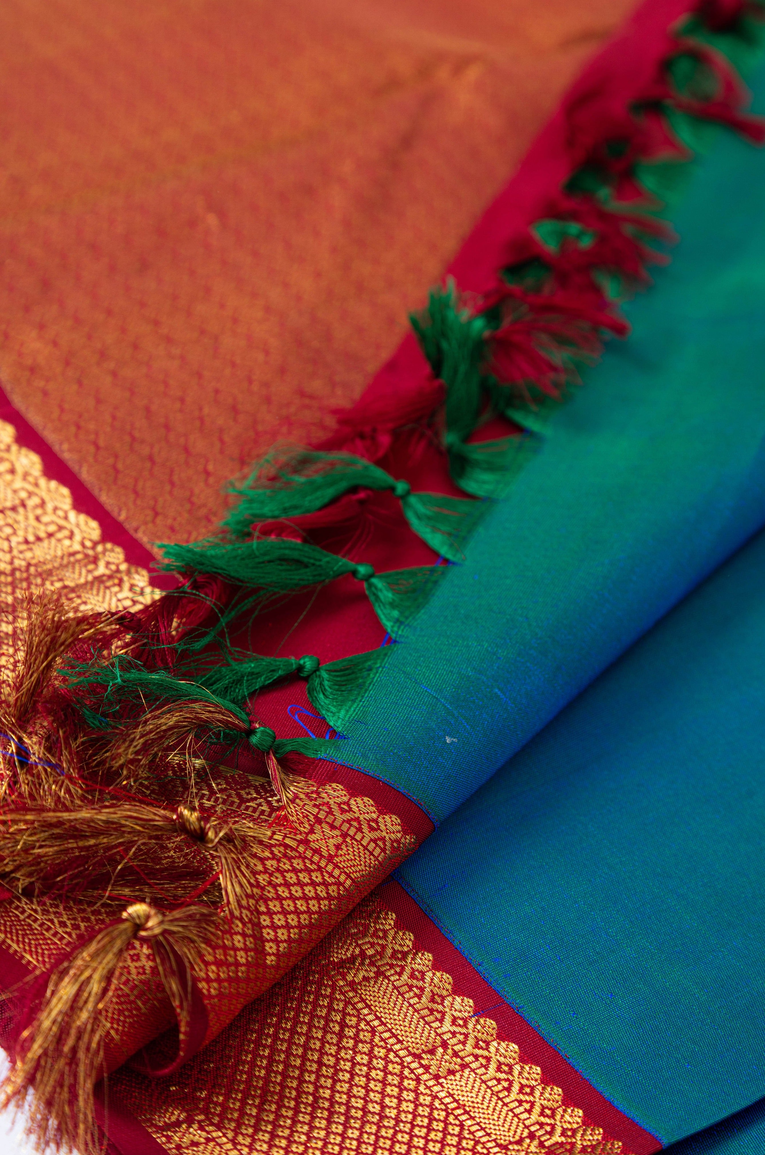 Peacock Blue Plain Kanjivaram Saree with Red Border