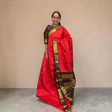 Orange Kanjivaram Saree with dark Brown and Golden Zari Border