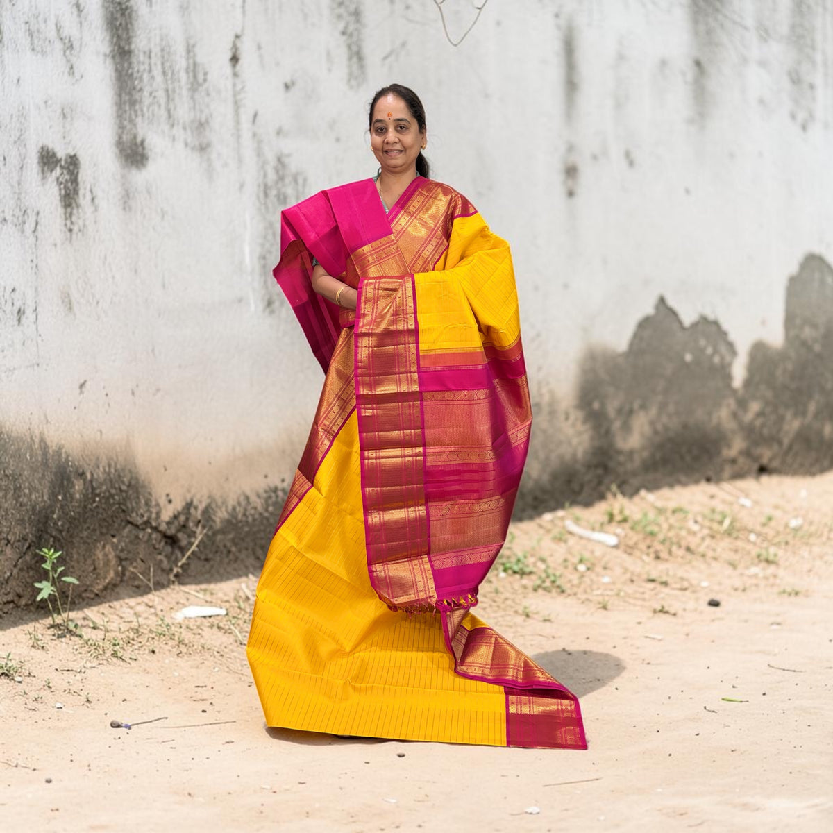 Yellow Kanjivaram Saree with Pink and Golden Zari Border
