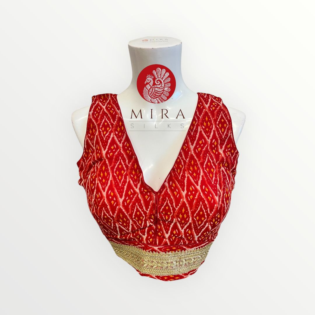 Reddish Orange Readymade Blouse with Mirror work and Embroidery and Tassel