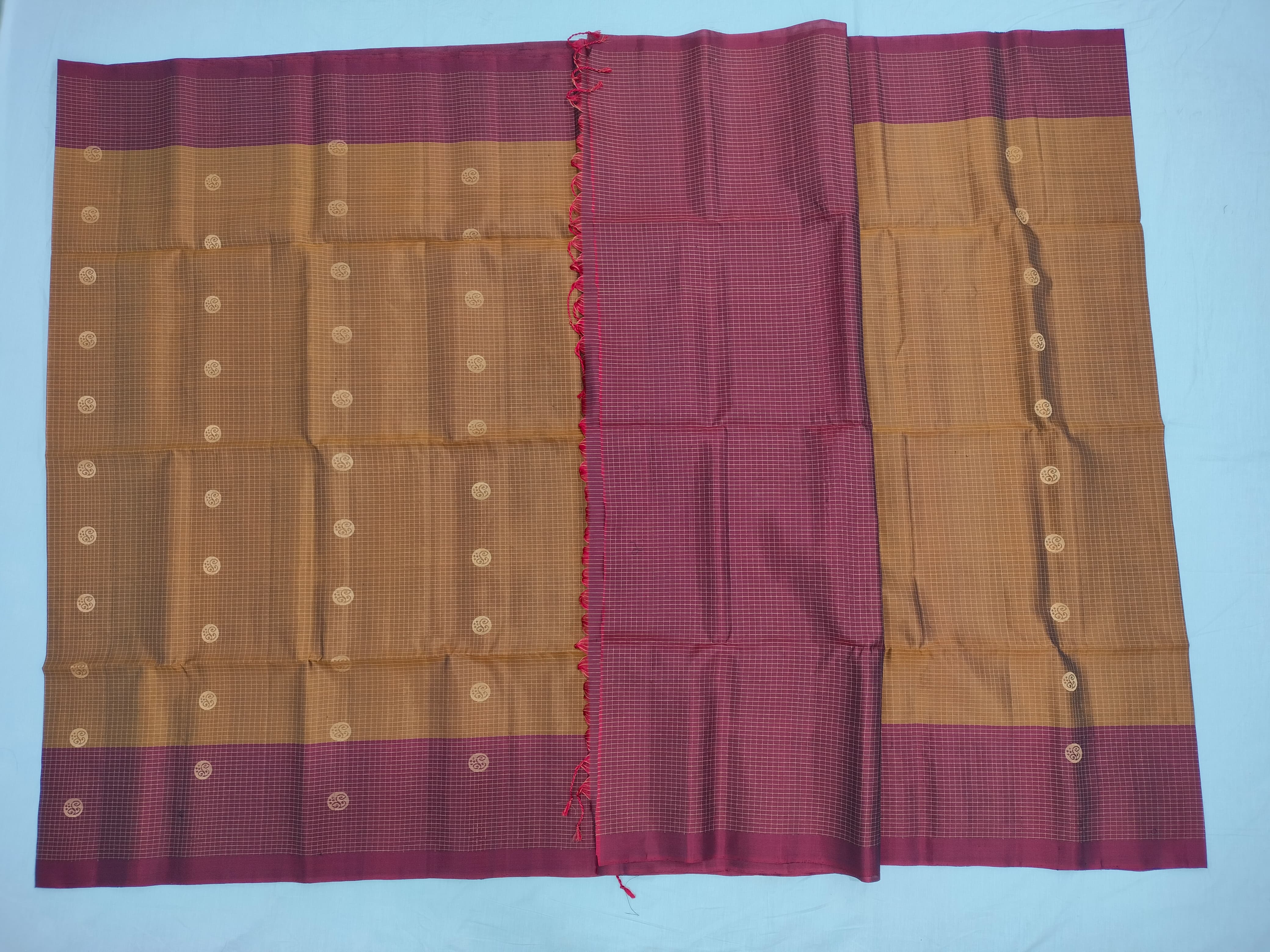 Honey color body with checks and Maroon Pallu oft Silk Saree