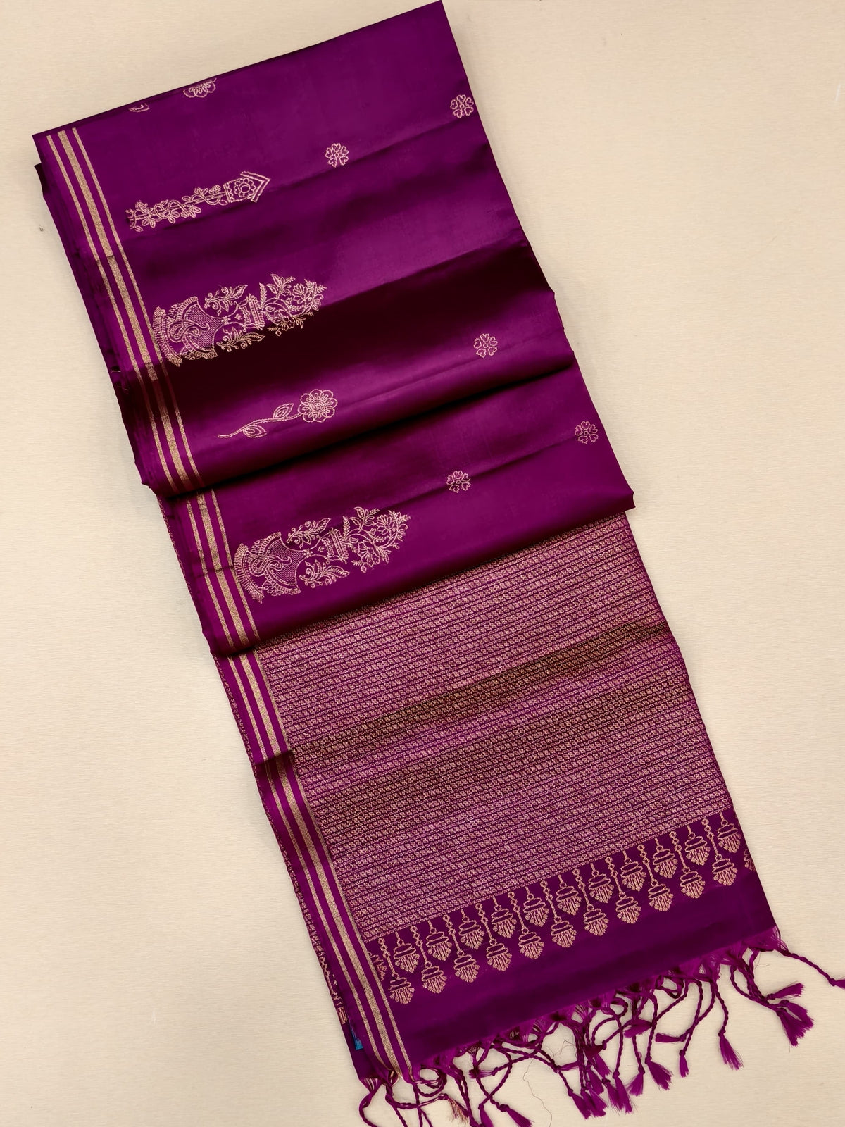 Magenta Soft Silk Saree with gold zari motifs and border